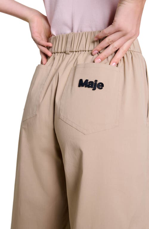 Shop Maje Wide-leg Cotton Trousers In Beige Light