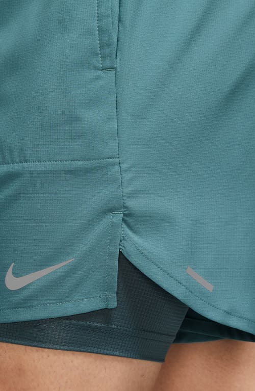 Shop Nike Dri-fit Stride 2-in-1 Running Shorts In Mineral Teal/reflective Silv