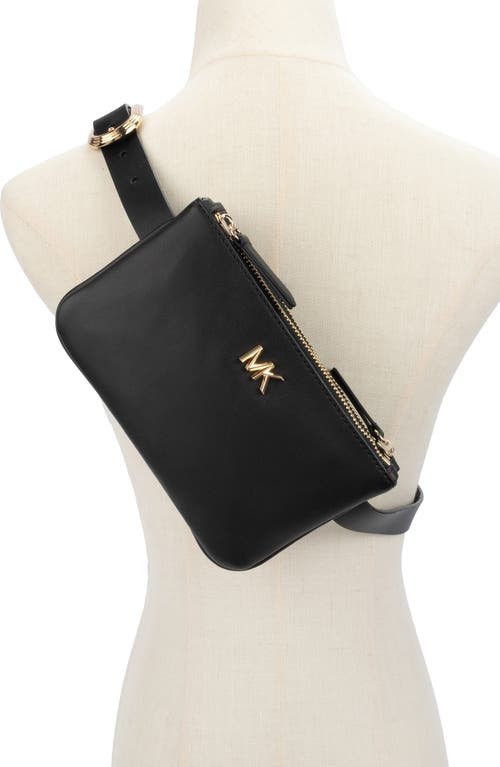 Shop Michael Michael Kors Reversible Leather Belt Bag In Black/gold