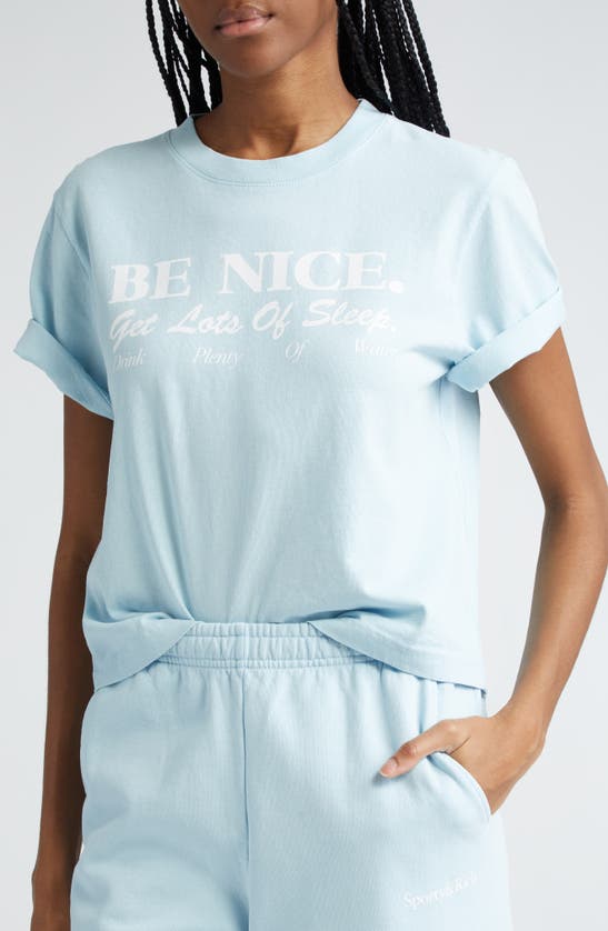 Shop Sporty And Rich Be Nice Cotton Crop Graphic T-shirt In Baby Blue