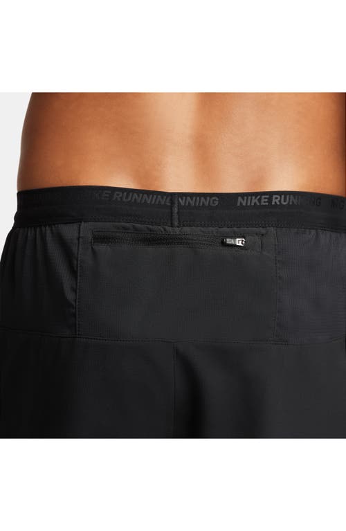 Shop Nike Dri-fit Stride Hybrid Running Shorts In Black/black/black