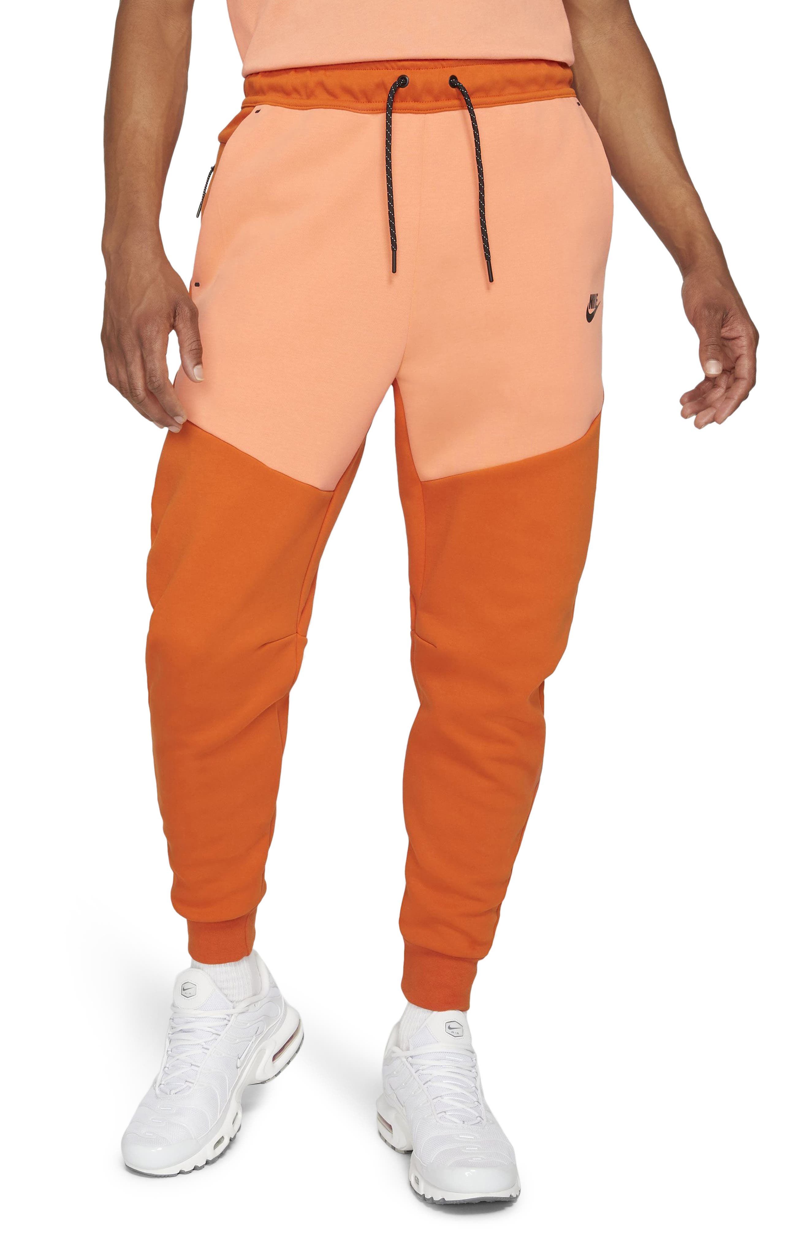 blue and orange nike jogging suit