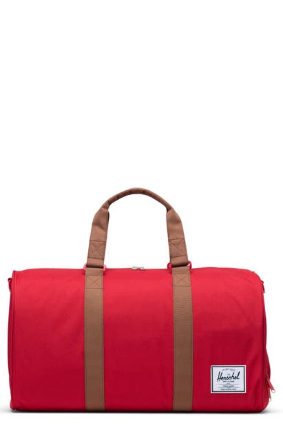 Click to view more detailed imagery on our partner's website Herschel Supply Co. Duffle Bag In Red/ Saddle Brown