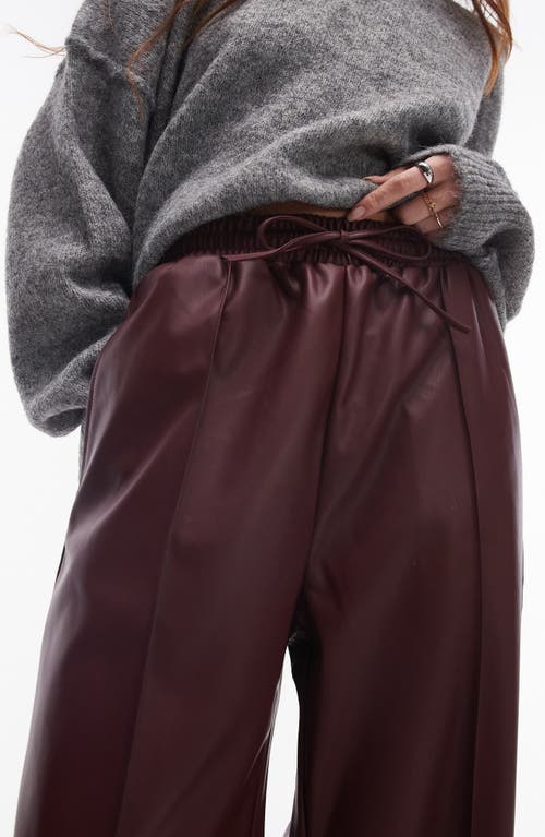 Shop Topshop Faux Leather Wide Leg Drawstring Pants In Burgundy