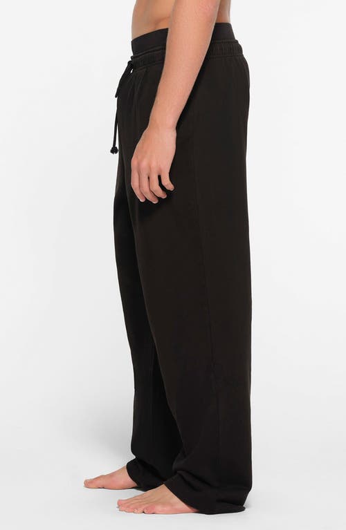 Shop Skims Straight Leg Cotton Lounge Pants In Washed Obsidian