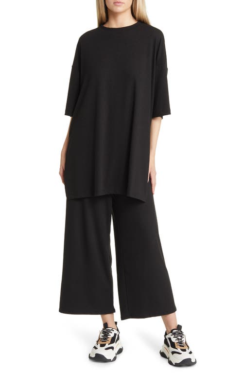 Dressed in Lala Lex Ribbed Oversize T-Shirt & High Waist Crop Pants Set in Black at Nordstrom, Size X-Large