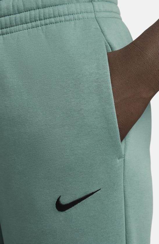 Shop Nike Sportswear Phoenix Fleece Mid Rise Joggers In Bicoastal/ Black