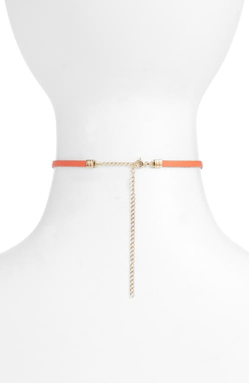 Shop Knotty Charm Choker In Orange/gold Chain
