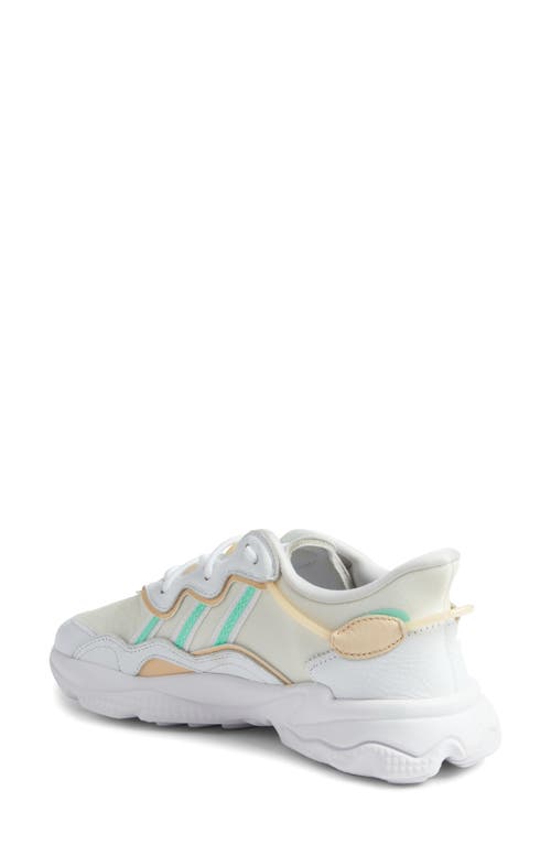 Shop Adidas Originals Adidas Ozweego Sneaker In White/mint/sand Strata