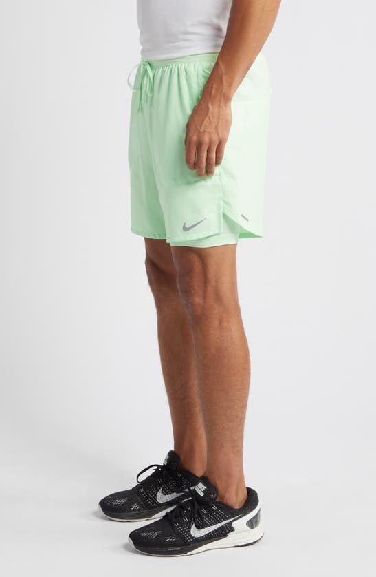 Shop Nike Dri-fit Stride 2-in-1 Running Shorts In Vapor Green/ Vapor Green