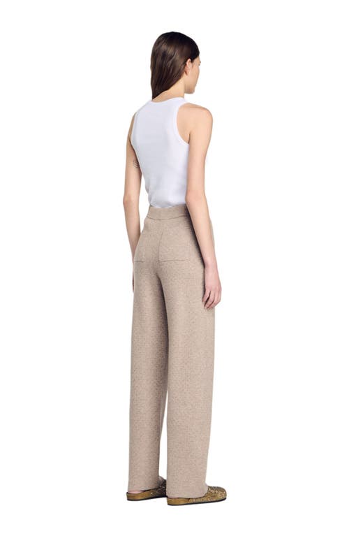 Shop Sandro Knit Rhinestone-covered Trousers In Beige