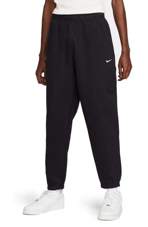 Nike Solo Swoosh Tapered Logo-embroidered Cotton-blend Jersey Sweatpants In Black