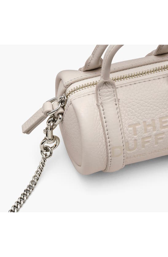Shop Marc Jacobs The Nano Duffle Leather Crossbody Bag In Cotton/ Silver