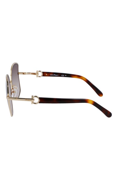 Shop Ferragamo Gancini 57mm Gradient Oval Sunglasses In Gold/brown Gradient