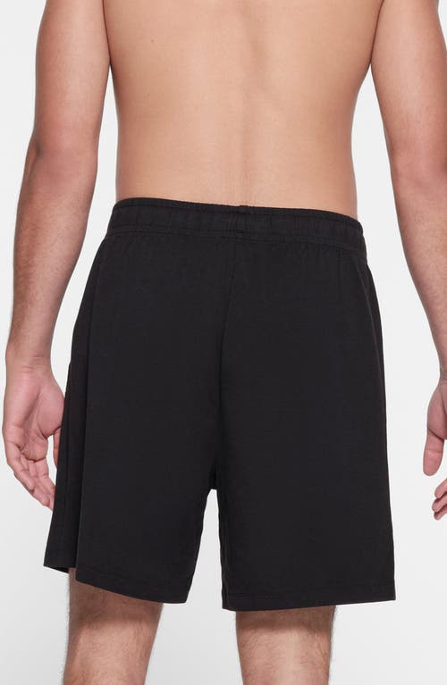 Shop Skims Stretch Cotton Blend Jersey Lounge Shorts In Obsidian