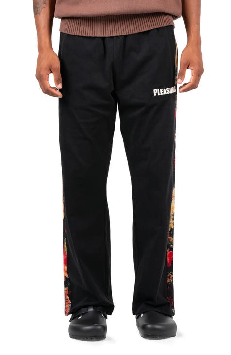 Nike Tapered Logo-Print Nylon Track Pants - Luxed