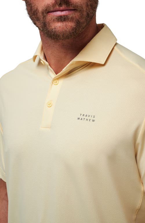 Shop Travismathew Heater Pro Performance Golf Polo In French Vanilla