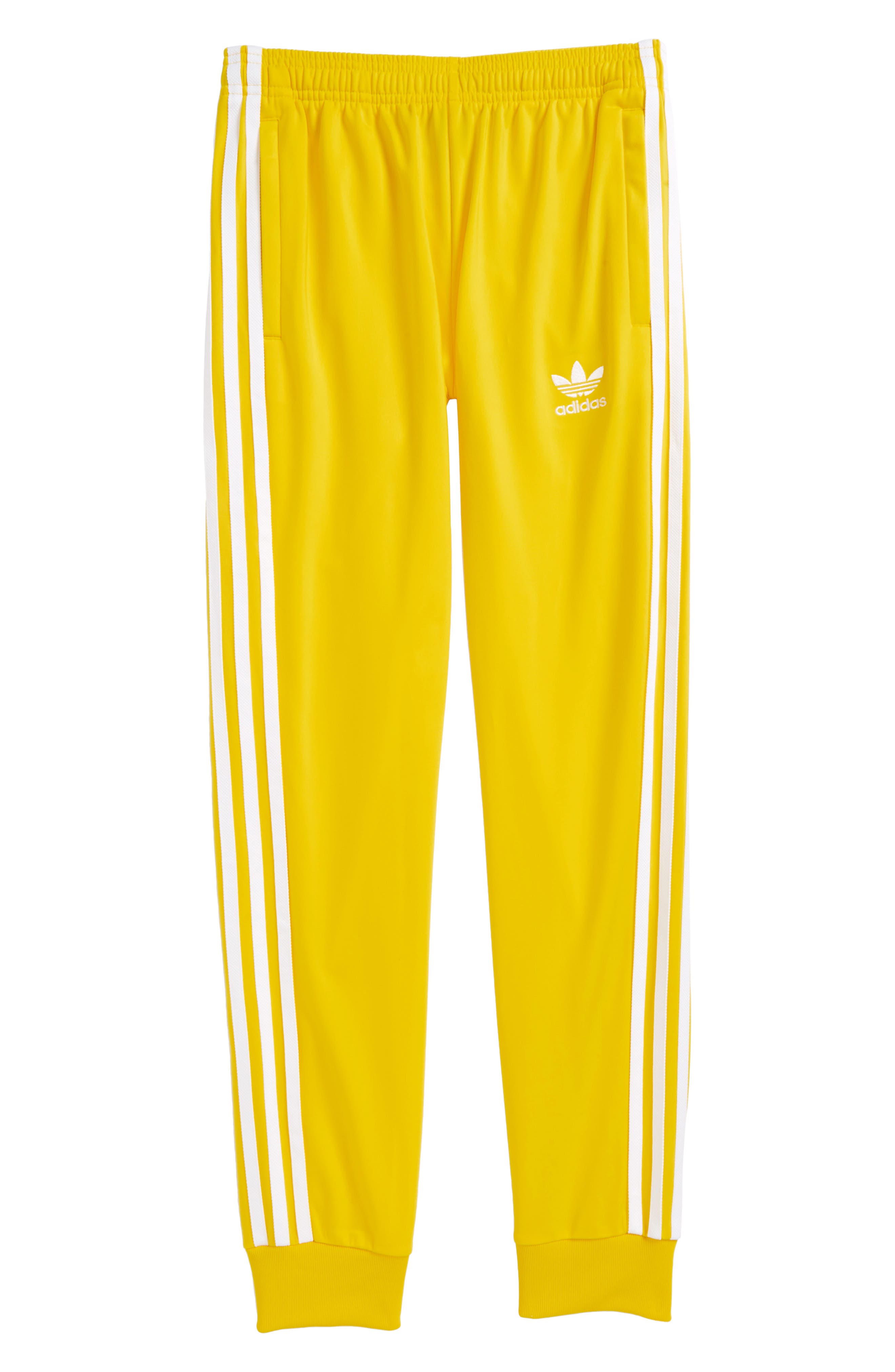 yellow adidas track pants