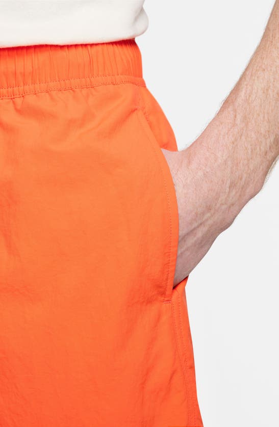 Shop Nike Club Flow Embroidered Nylon Shorts In Safety Orange/ White