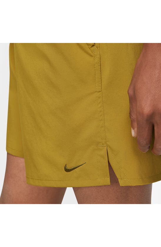 Shop Nike Dri-fit Unlimited 7-inch Unlined Athletic Shorts In Bronze