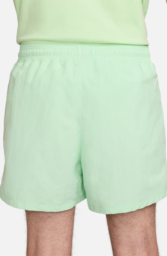 Shop Nike Acg Reservoir Goat Water Repellent Hybrid Shorts In Vapor Green/ Summit White