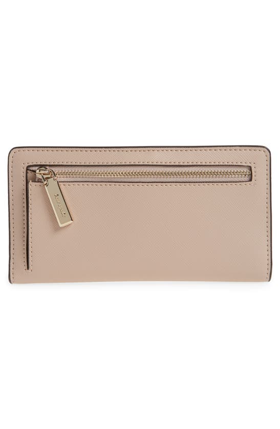 Shop Kate Spade Schuyler Large Slim Bifold Wallet In Warm Beige