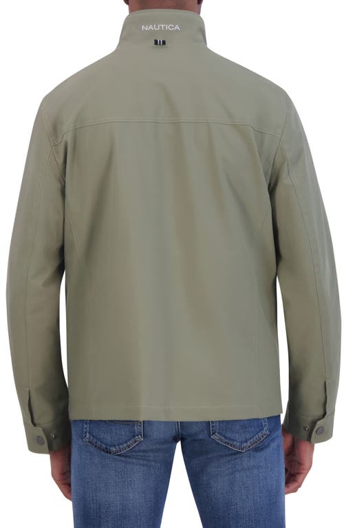 Shop Nautica Lightweight Stretch Water Resistant Golf Jacket In Dusty Olive