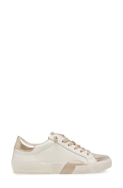 Shop Dolce Vita Zina Sneaker In White/gold Leather