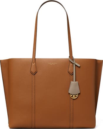 Tory Burch Perry Triple Compartment Pebbled Leather Tote Bag in black.