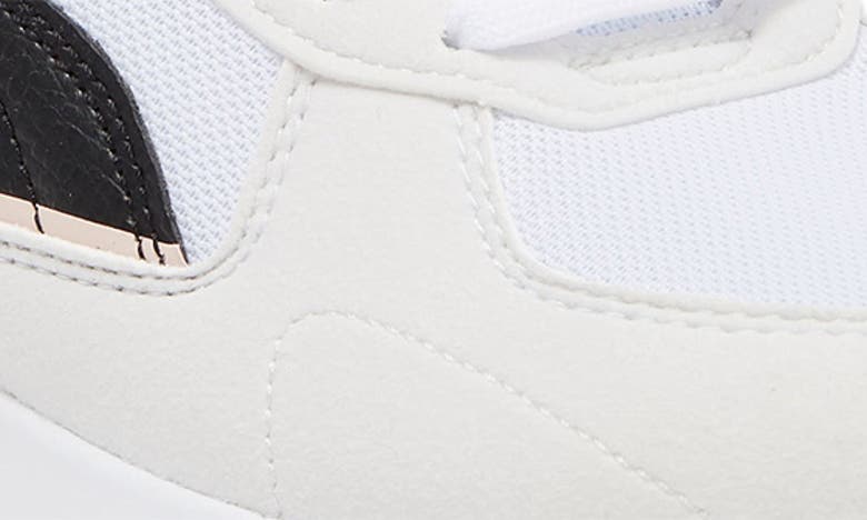 Shop Puma Lace-up Graviton Sneaker In Alpine Snow- White-amber