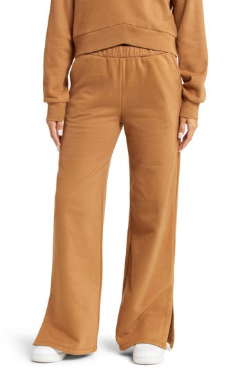 Beyond Yoga On The Go Wide Leg Flare Pants In Toffee