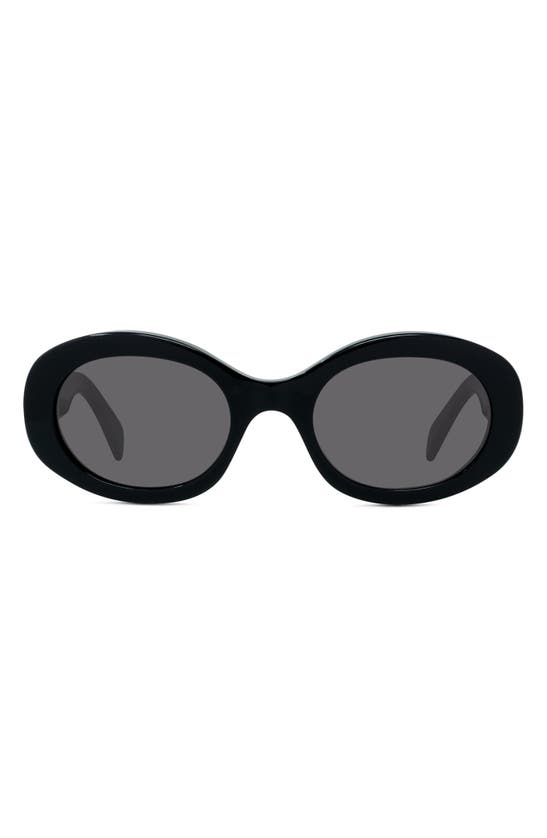 Shop Celine Triomphe 52mm Oval Sunglasses In Shiny Solid Black/ Smoke