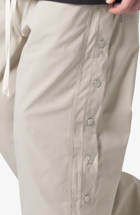 Mnml Oversize Side Snap Nylon Pants In Tan