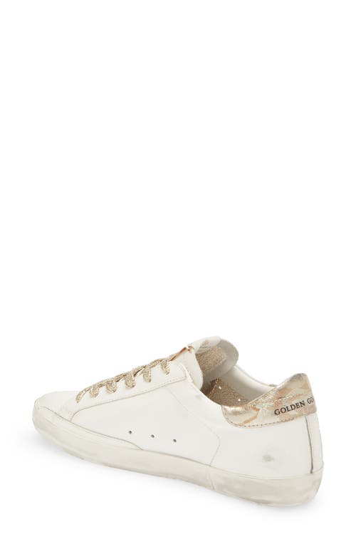 Shop Golden Goose Super-star Low Top Sneaker In White/gold