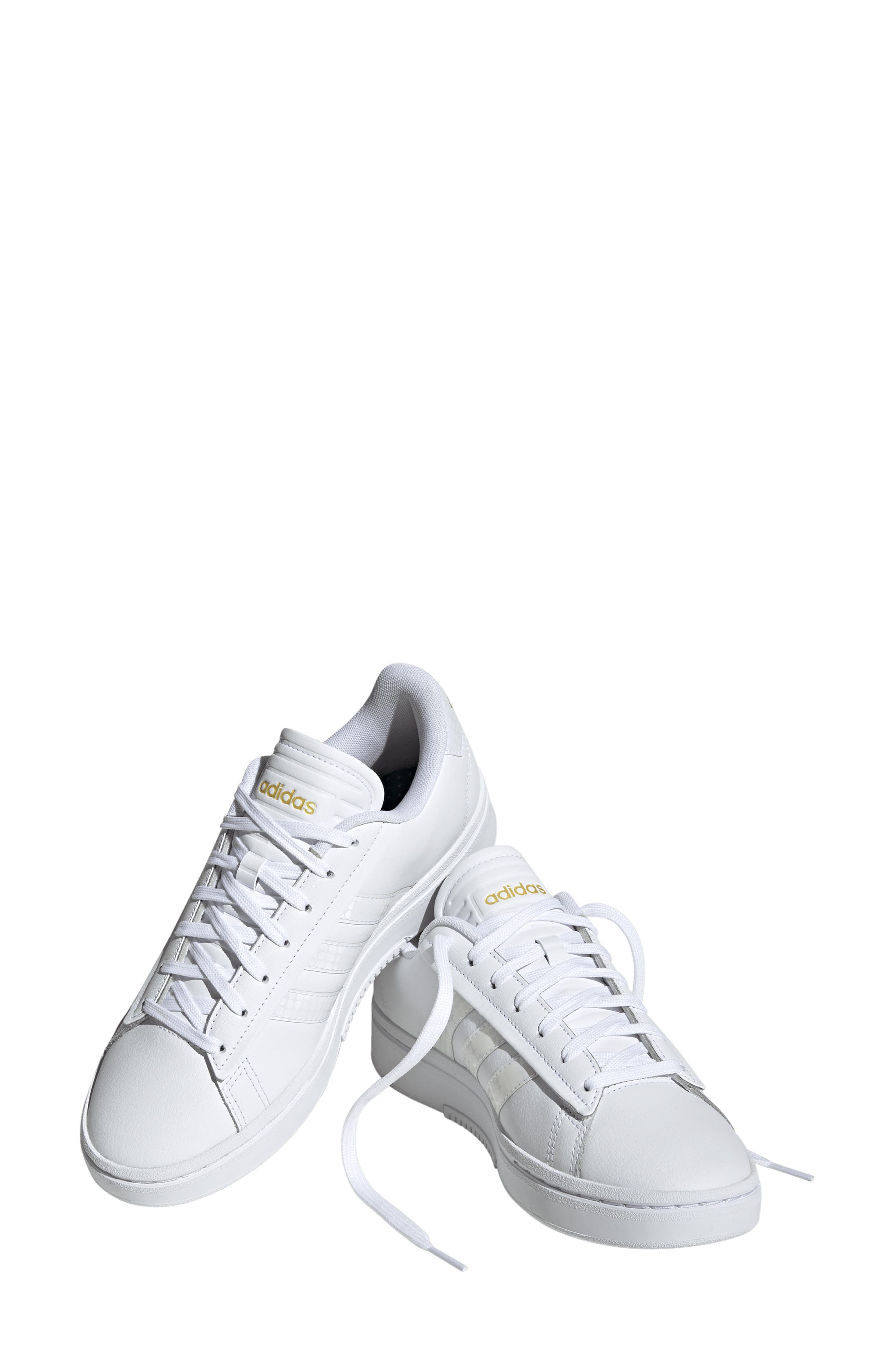 gold colored tennis shoes