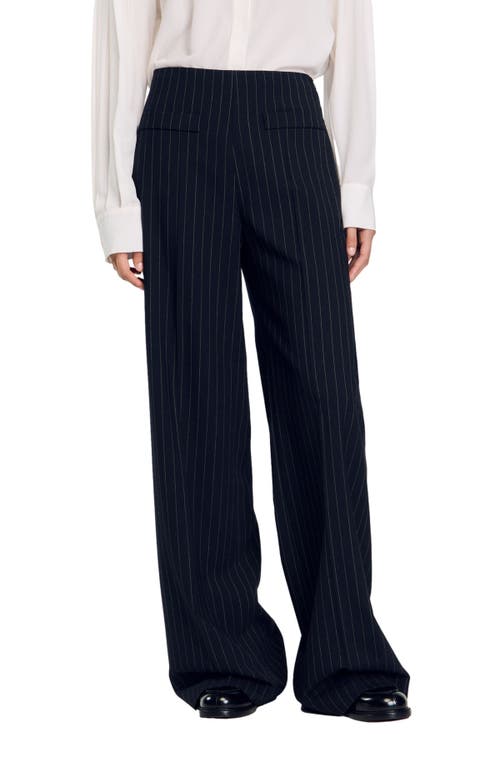 Shop Sandro Chalk-striped Trousers In Black