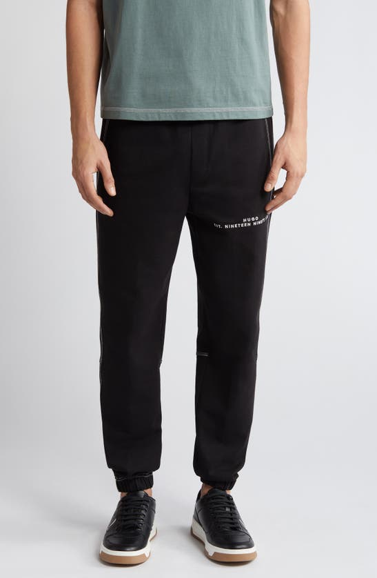 Shop Hugo Boss Hugo Dirabelo Embroidered Logo Drawstring Pants In Black