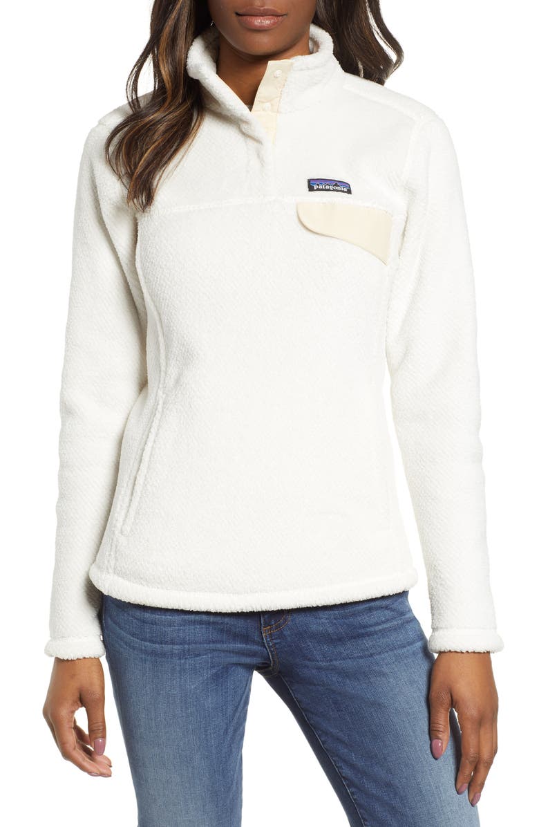 PATAGONIA Re-Tool Snap-T<sup>®</sup> Fleece Pullover, Main, color, RAW LINEN – WHITE X-DYE SIZE INFO XXS=00-0, XS=0-2, S=4-6, M=8-10, L=12-14, XL=16. DETAILS & CARE A slimmer fit and seaming that highlights a woman’s figure update a cozy top constructed of lightweight deep-pile Polartec® Thermal Pro® fleece with a pleasing texture and handy compressibility. Wear it alone when the weather cooperates or layered when things start to get messy.  26″ length (size Medium) Supplex® nylon-reinforced four-snap placket with stand collar Brushed microfleece trim on cuffs and hem Kangaroo hand-warmer pocket; chest flap pocket 51% recycled polyester, 49% polyester Machine wash, tumble dry Imported Women’s Active & Swim As a founding member of 1% for the Planet, Patagonia has committed to donating 1% of its annual sales to nonprofit partners in support of environmental solutions Item #5641376 Helpful info: See details and tips from a salesperson (video) [Activewear Glossary] Free Shipping & Returns See more (51) Re-Tool Snap-T® Fleece Pullover PATAGONIA