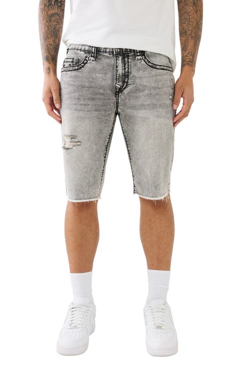 ASOS DESIGN shorter length denim shorts in mid wash with heavy rips