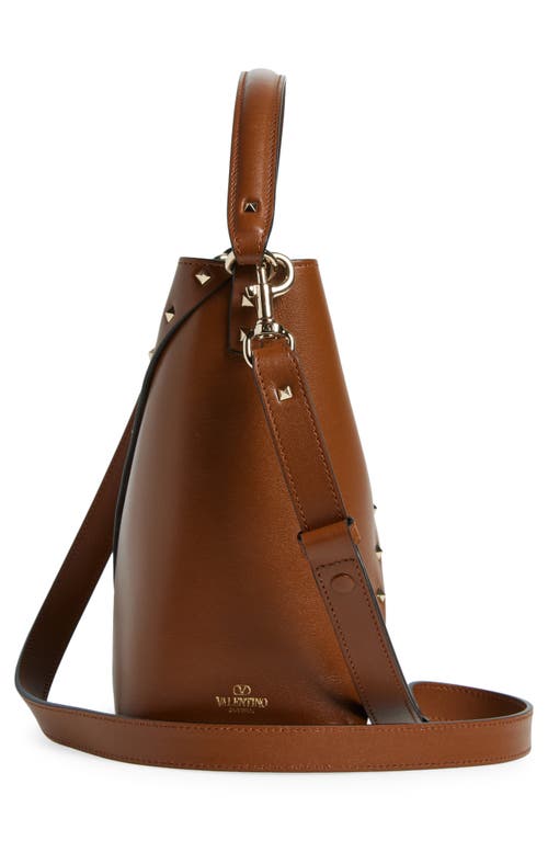 Shop Valentino Garavani Rockstud Wispy Crossbody Bucket Bag In Tobacco