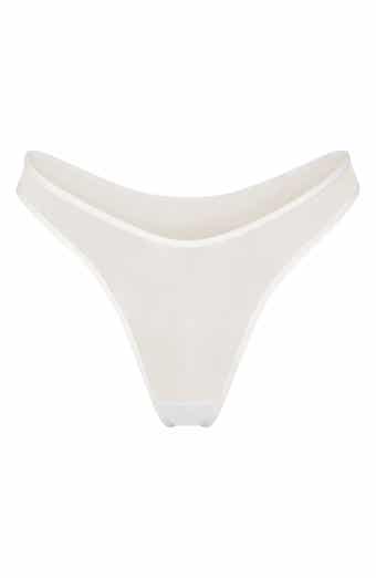 SKIMS - Kim Kardashian West wears the Dipped Front Thong ($19) in