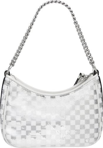A guest wears white mesh with green LV monogram print pattern