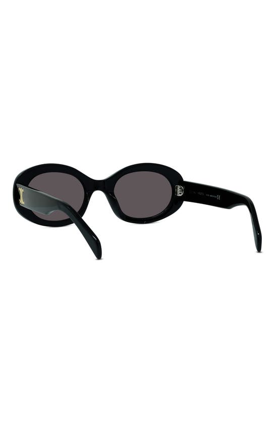 Shop Celine Triomphe 52mm Oval Sunglasses In Shiny Solid Black/ Smoke