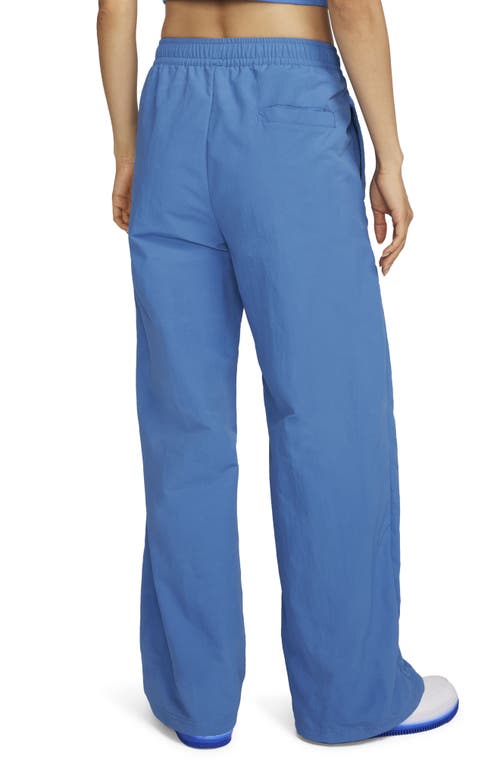 Shop Nike Wide Leg Pants In Star Blue/metallic Copper