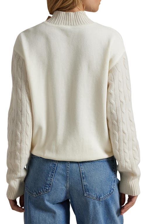 Shop Polo Ralph Lauren Cable Stitch Sleeve Mock Neck Sweatshirt In Clubhouse Cream