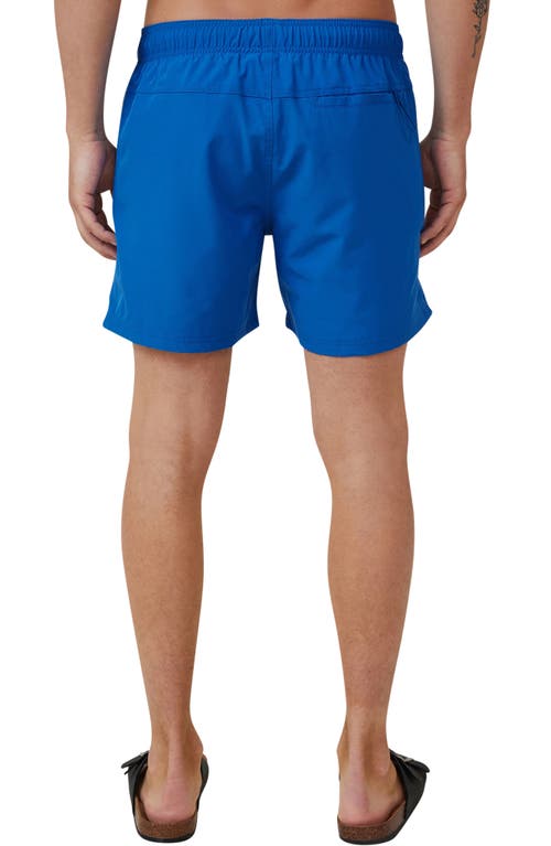 Shop Cotton On Stretch Swim Trunks In Pacific Blue