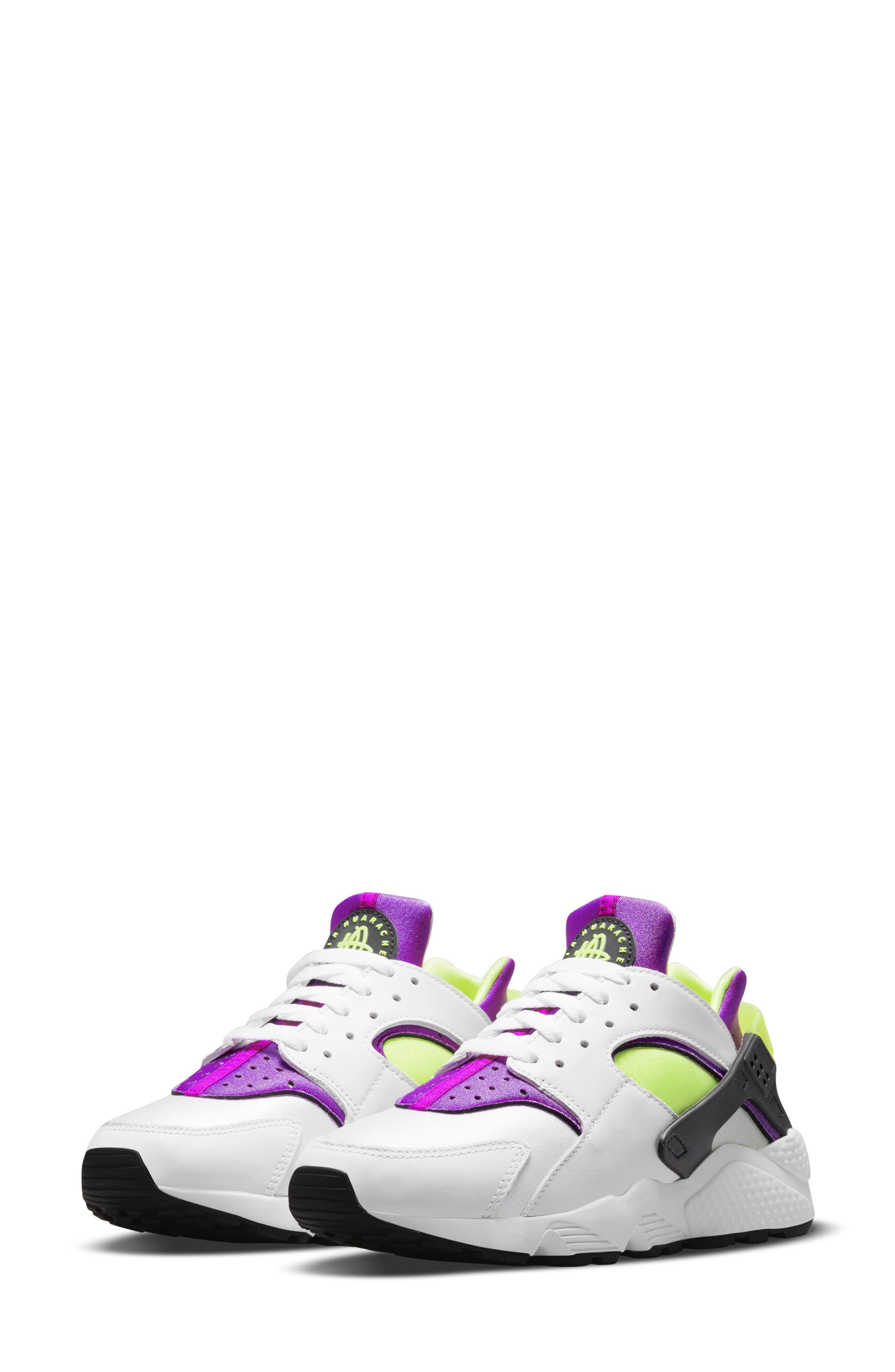 purple and white running shoes