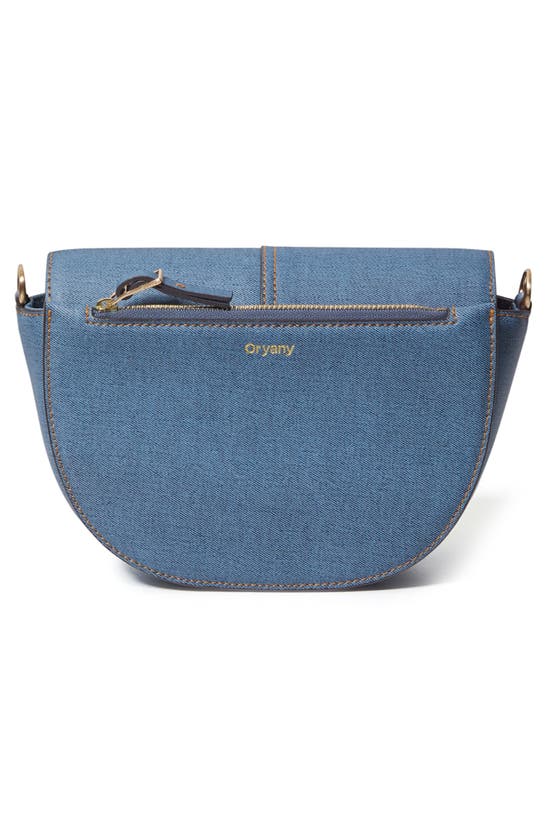 Shop Oryany Lottie Denim Crossbody Bag In Denim Blue