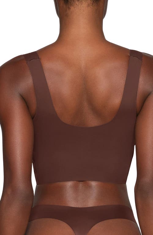 Shop Skims Naked Wireless Scoop Longline Bra In Cocoa