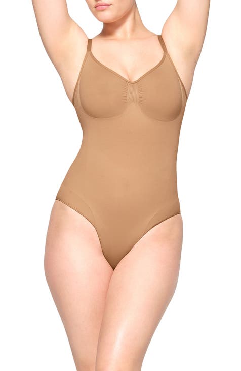 SKIMS Stretch Satin Smoothing Bodysuit in Honey, SKIMS Is Launching a Sexy Stretch  Satin Lingerie Line Just in Time For Valentine's Day